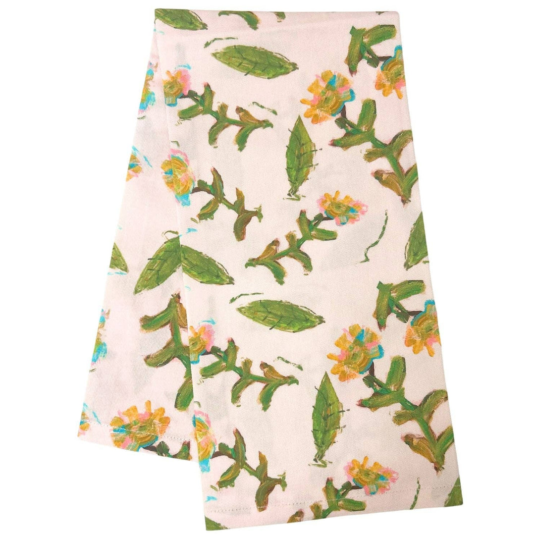 Flor Rosa tea towel by Laura Park Designs featuring a floral pink and white pattern on soft cotton fabric.