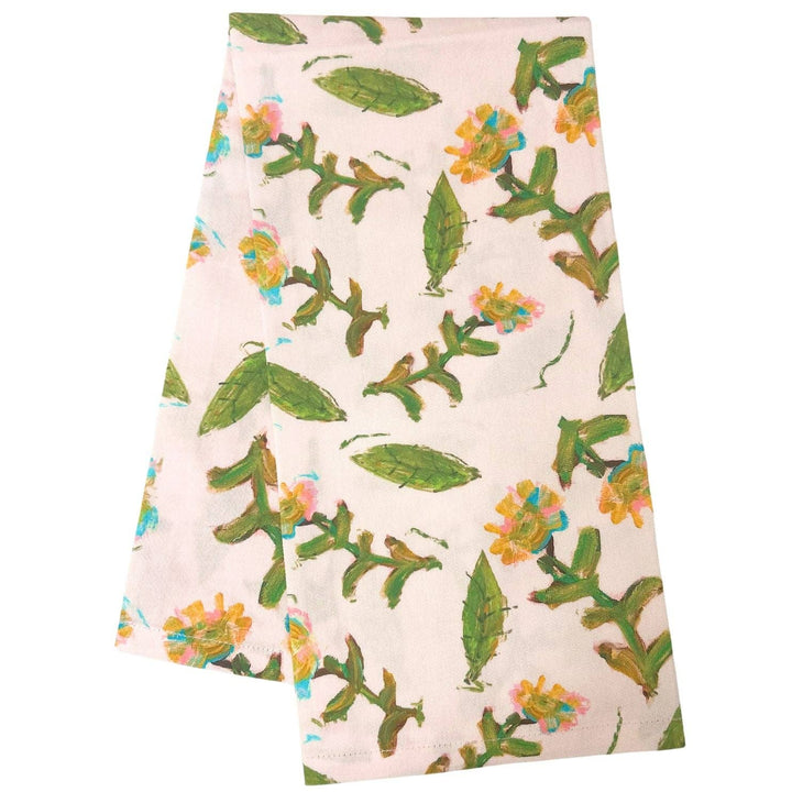 Flor Rosa tea towel by Laura Park Designs featuring a floral pink and white pattern on soft cotton fabric.