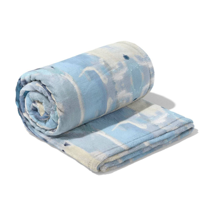 Ocean Breeze fleece blanket by Laura Park Designs, soft throw in ocean-inspired colors, perfect for cozy home decor.