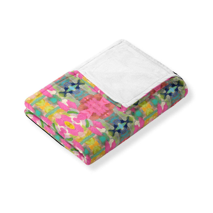 Soft pink fleece blanket from Laura Park Designs with a cozy, plush texture, perfect for home use.