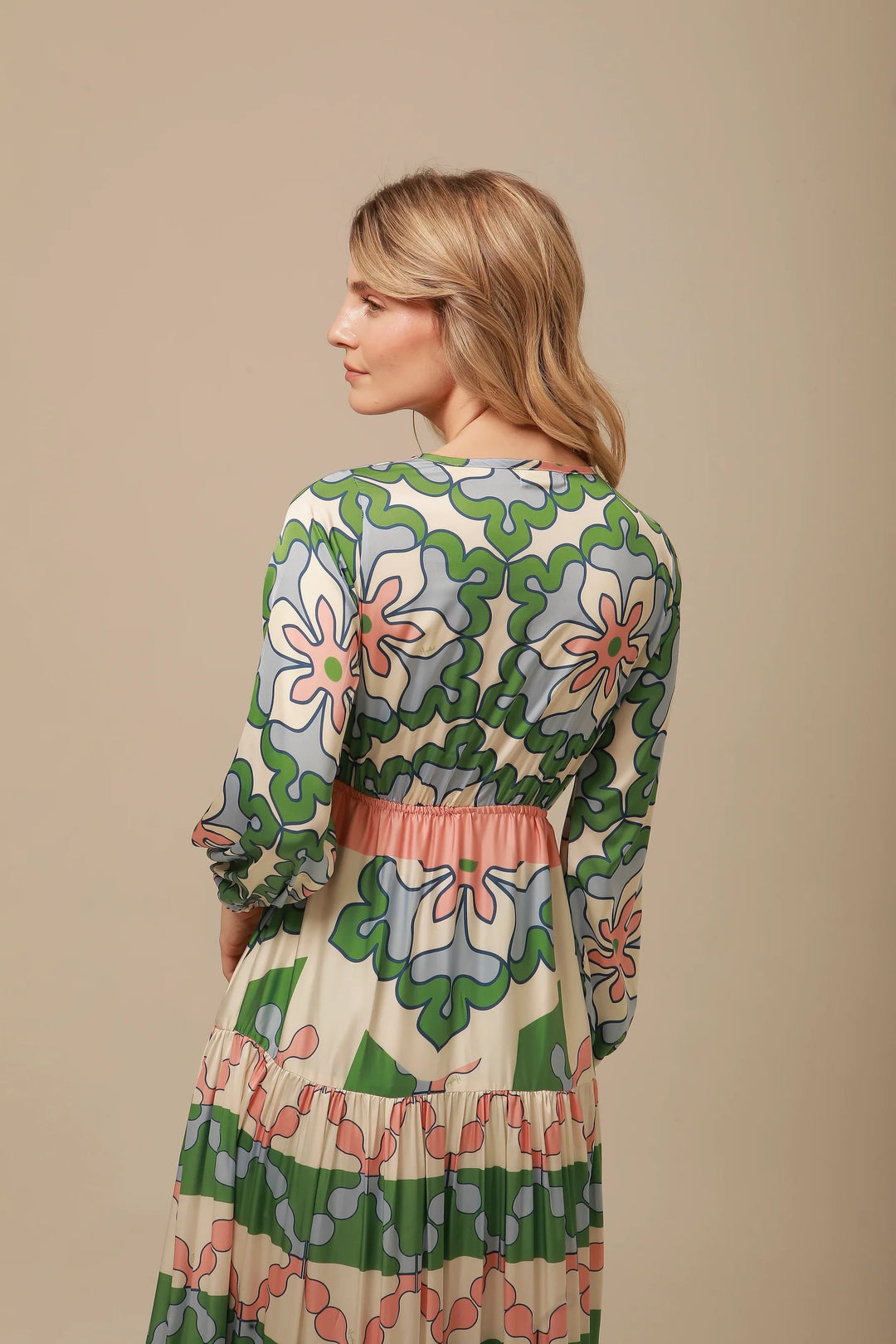 Lavi by Majolavi floral Eva maxi dress with colorful flower patterns and flowing fabric, shown on a hanger.