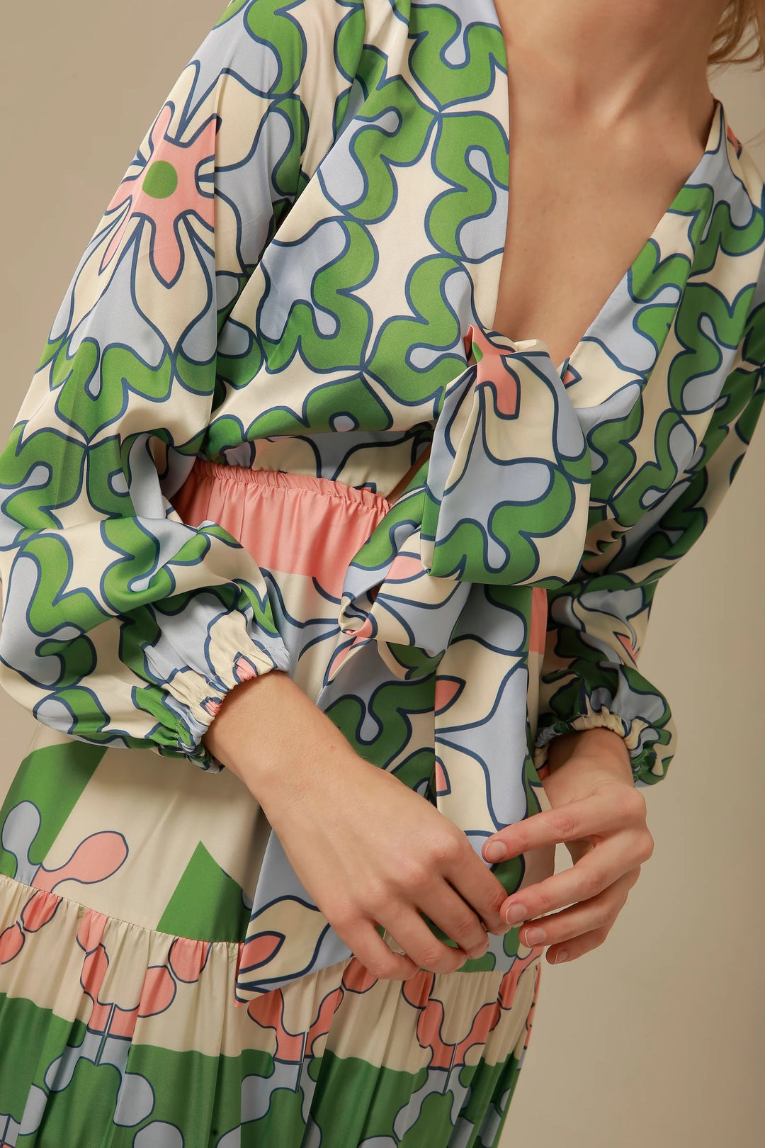 Floral Eva Maxi Dress by Lavi by Majolavi, showcasing a flowing dress with colorful floral patterns and a fitted waist.