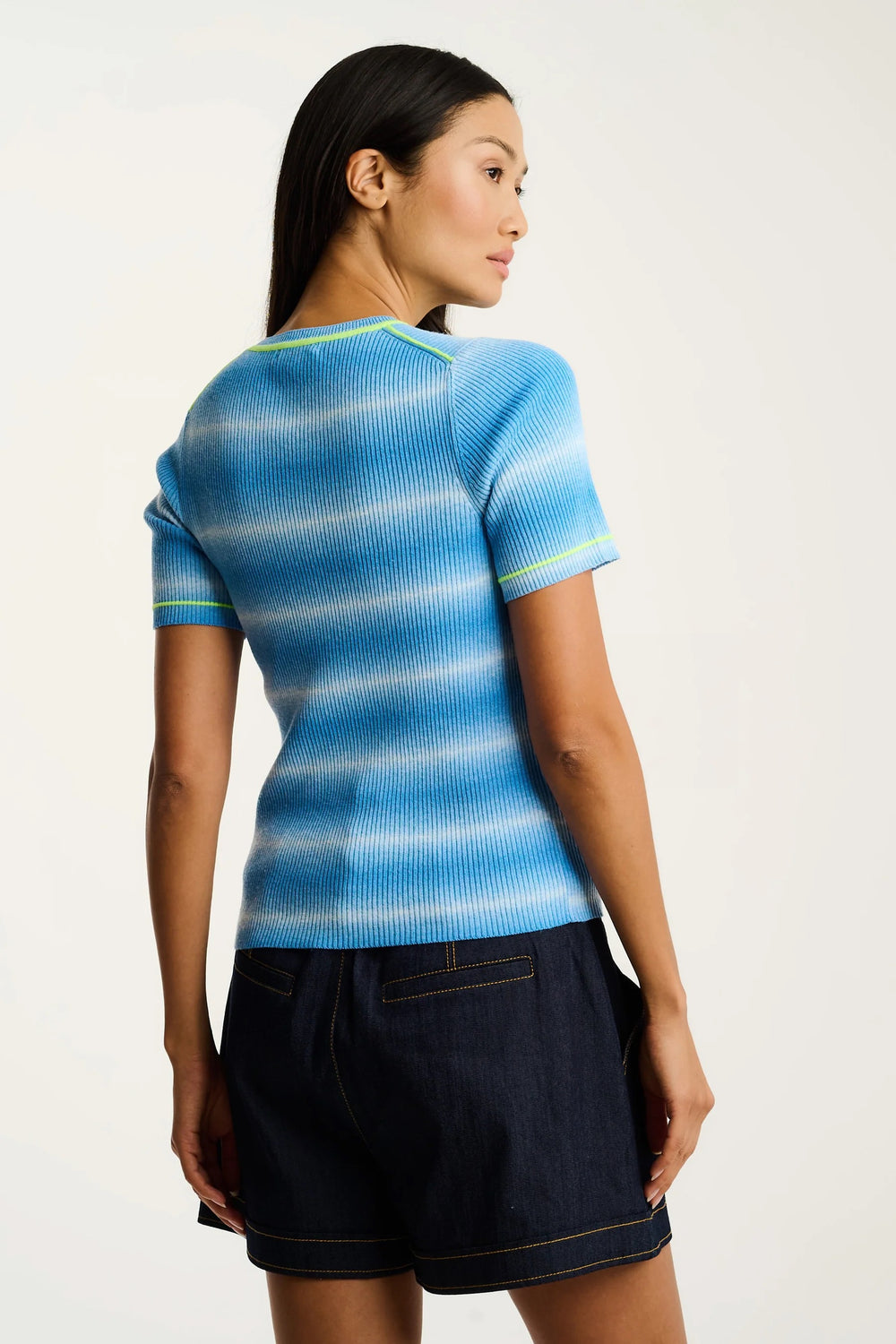 Lisa Todd International Fade In Sweater, stylish tops with a soft, fade-in color design, shown on a model in a casual setting.