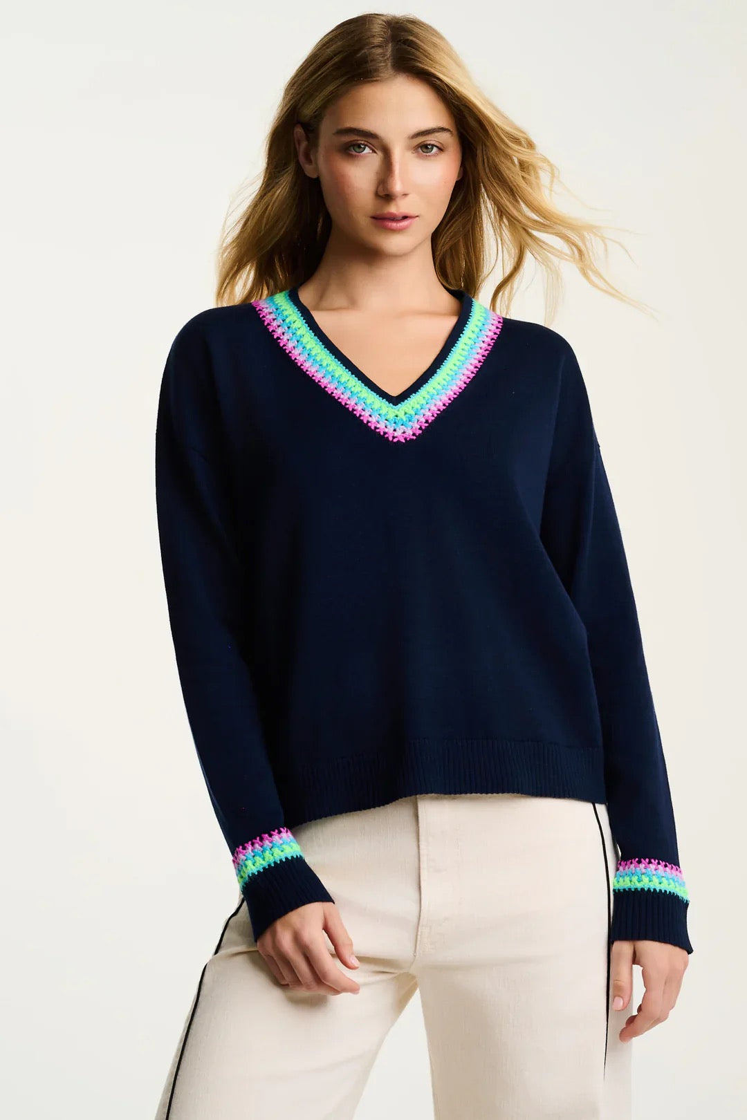 Lisa Todd International In The Mix sweater, stylish tops in soft knit fabric with a modern design, shown on a model.