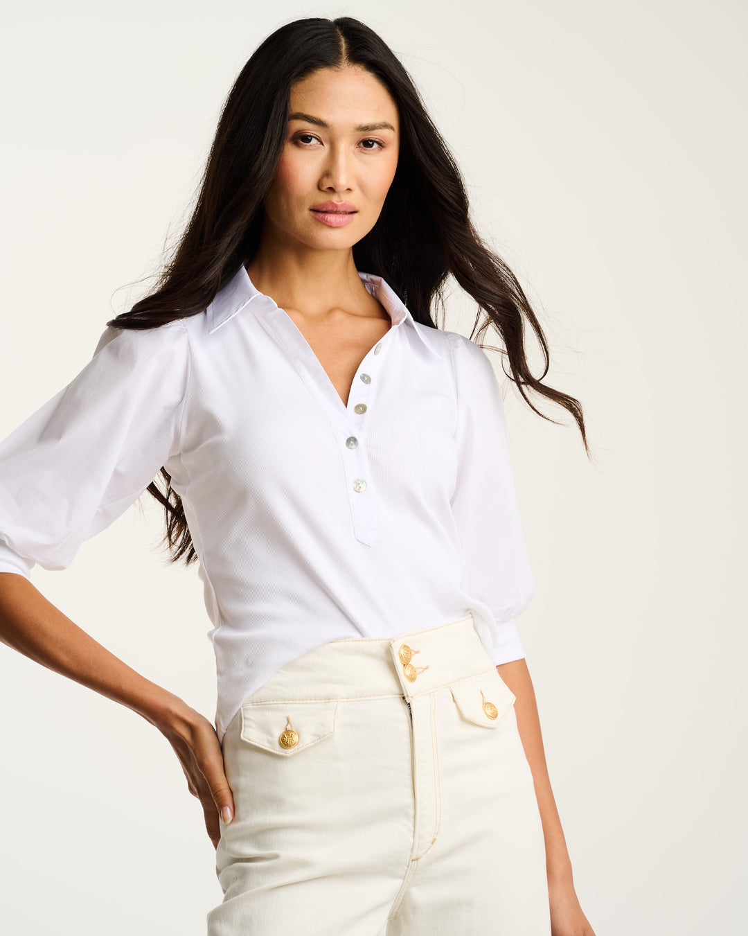 White ribbed Collette top by Lisa Todd International, close-up of fitted sleeveless design and textured fabric.