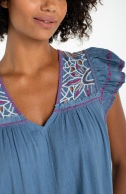 Liverpool Jeans flutter sleeve mini dress featuring a fitted bodice, flutter sleeves, and a stylish short skirt in a vibrant fabric.