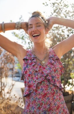 Liverpool Jeans sleeveless ruffle maxi dress shown hanging on a hanger with flowy fabric and ruffle details.