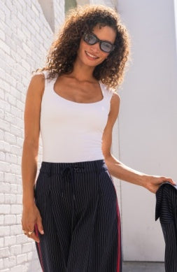 Sleeveless top with built-in bra from Liverpool Jeans, featuring a fitted design and sleeveless style, shown on a hanger.