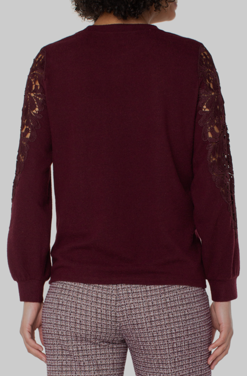 Lace sleeve knit top from Liverpool Jeans featuring a soft fabric with delicate lace detailing on the sleeves.
