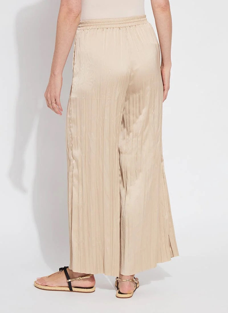 Lysse packable 28-inch palazzo pants in lightweight, flowy fabric, shown folded and laid flat as stylish, comfortable bottoms.