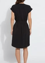 Lysse Blakely pull-on dress in black fabric, close-up of the fitted style showing smooth, stretchy material and sleek design.