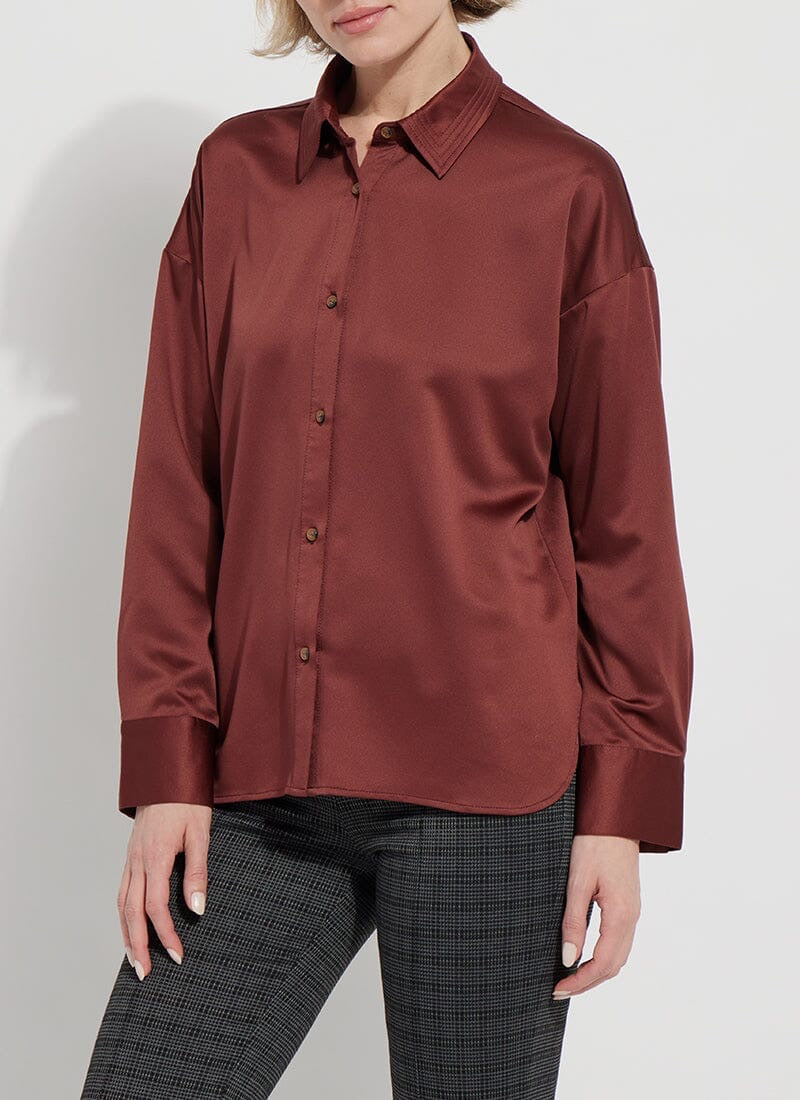 Lysse Kristin stitched shirt, stylish top with detailed stitching, displayed on a hanger against a neutral background.