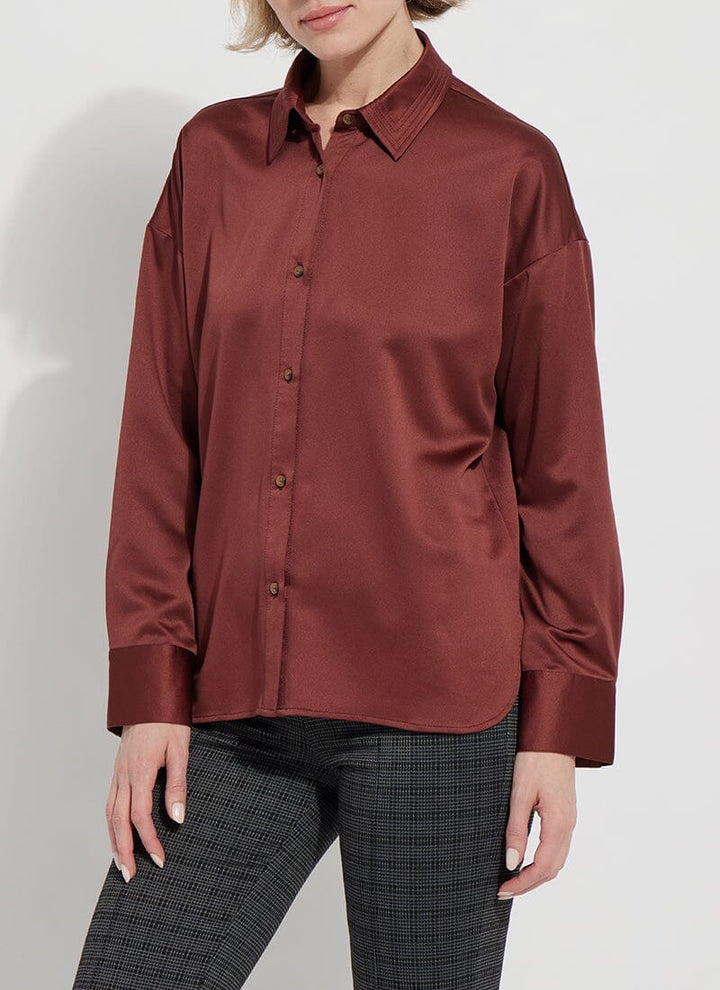 Lysse Kristin stitched shirt, stylish top with detailed stitching, displayed on a hanger against a neutral background.
