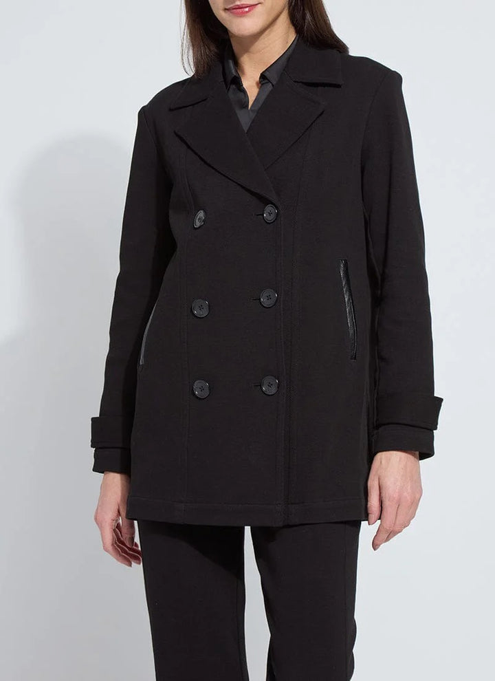 woman wearing black mid-thigh peacoat with buttons on a white background