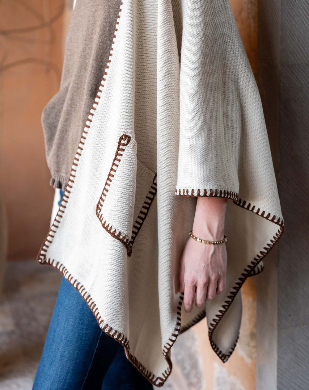 Mer-sea whipstitch cream travel wrap, soft accessories with stylish whipstitch detailing, perfect for cozy travel comfort.