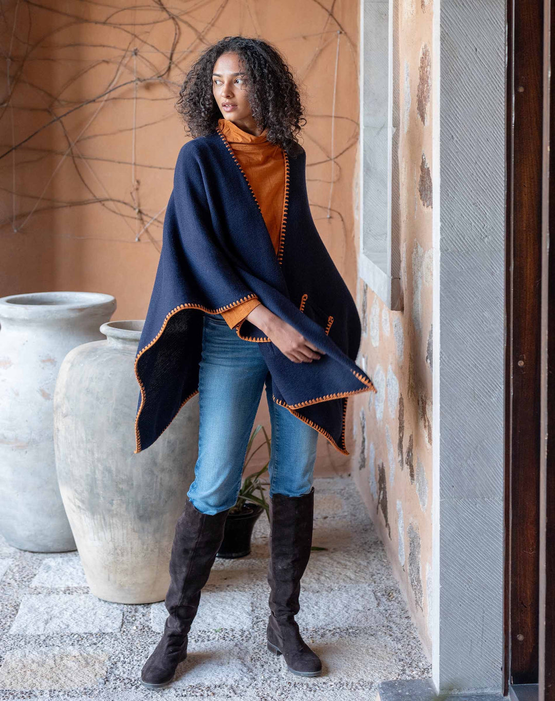 Navy travel wrap with whipstitch detailing from mer-sea, cozy and stylish accessories for travel and relaxation.