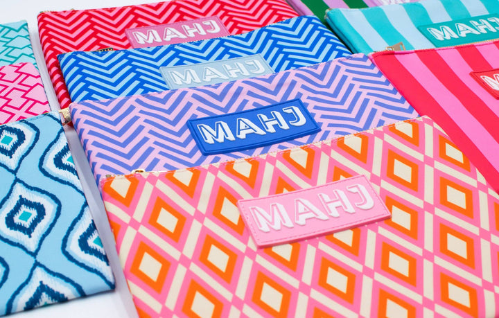 My Fair Mahjong gift bag with Mahjong cards and accessories, featuring decorative design and secure handle for easy carrying.