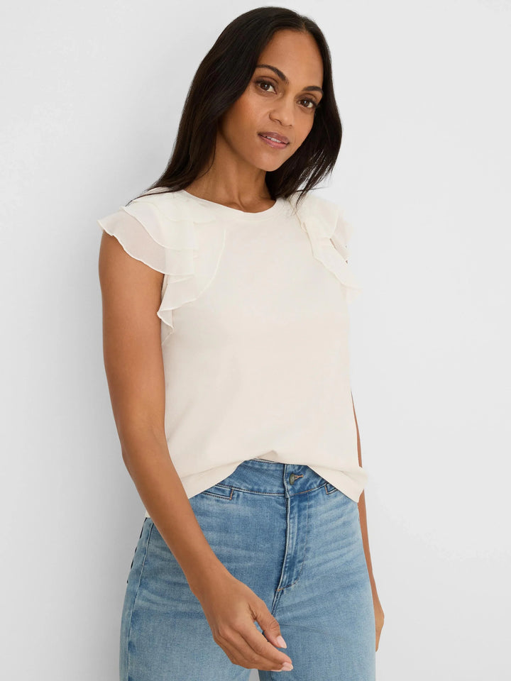 Light pink chiffon Nic & Zoe drift top with flowy fabric and relaxed fit, shown on a model.