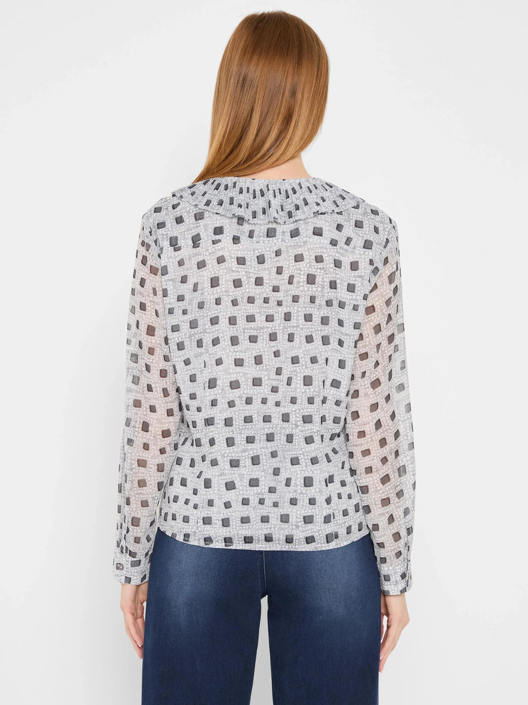 Nic & Zoe Dotty Ruffles Blouse, stylish women's top with ruffle details and playful dot pattern, displayed on a hanger.