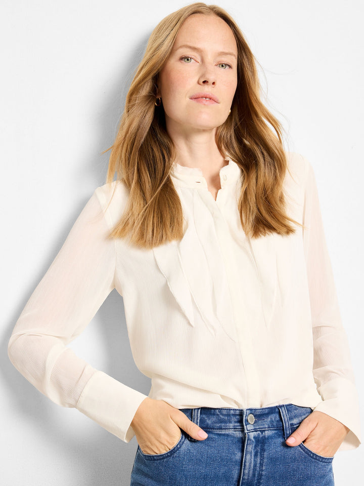 Ivory chiffon blouse by Nic & Zoe, flowing top with delicate fabric and elegant design, showcased on a model.