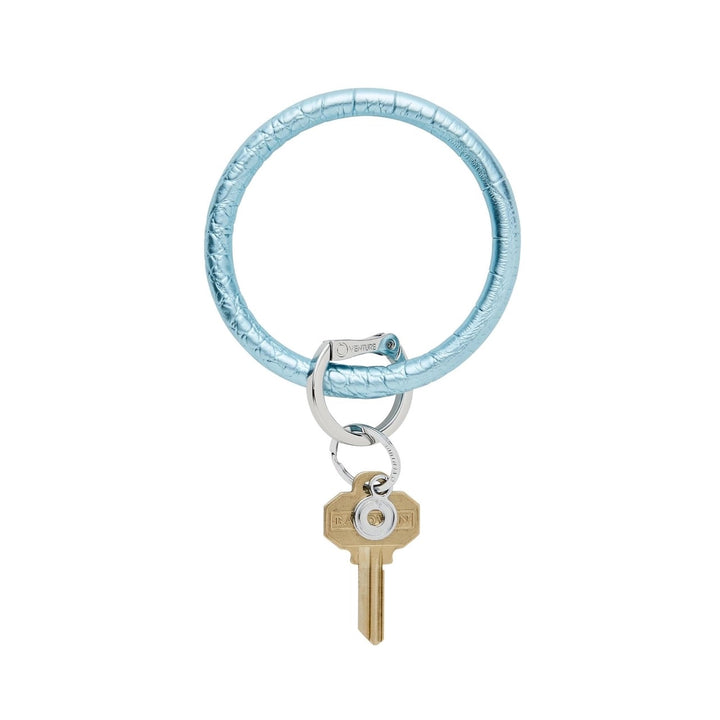 O-venture leather "O" Ring key ring with a stylish leather strap and metal ring, perfect for holding keys and accessories.