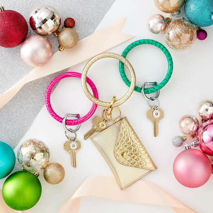 O-venture leather key ring with an "O" ring and keychain attachment, designed for stylish gift-giving and everyday use.