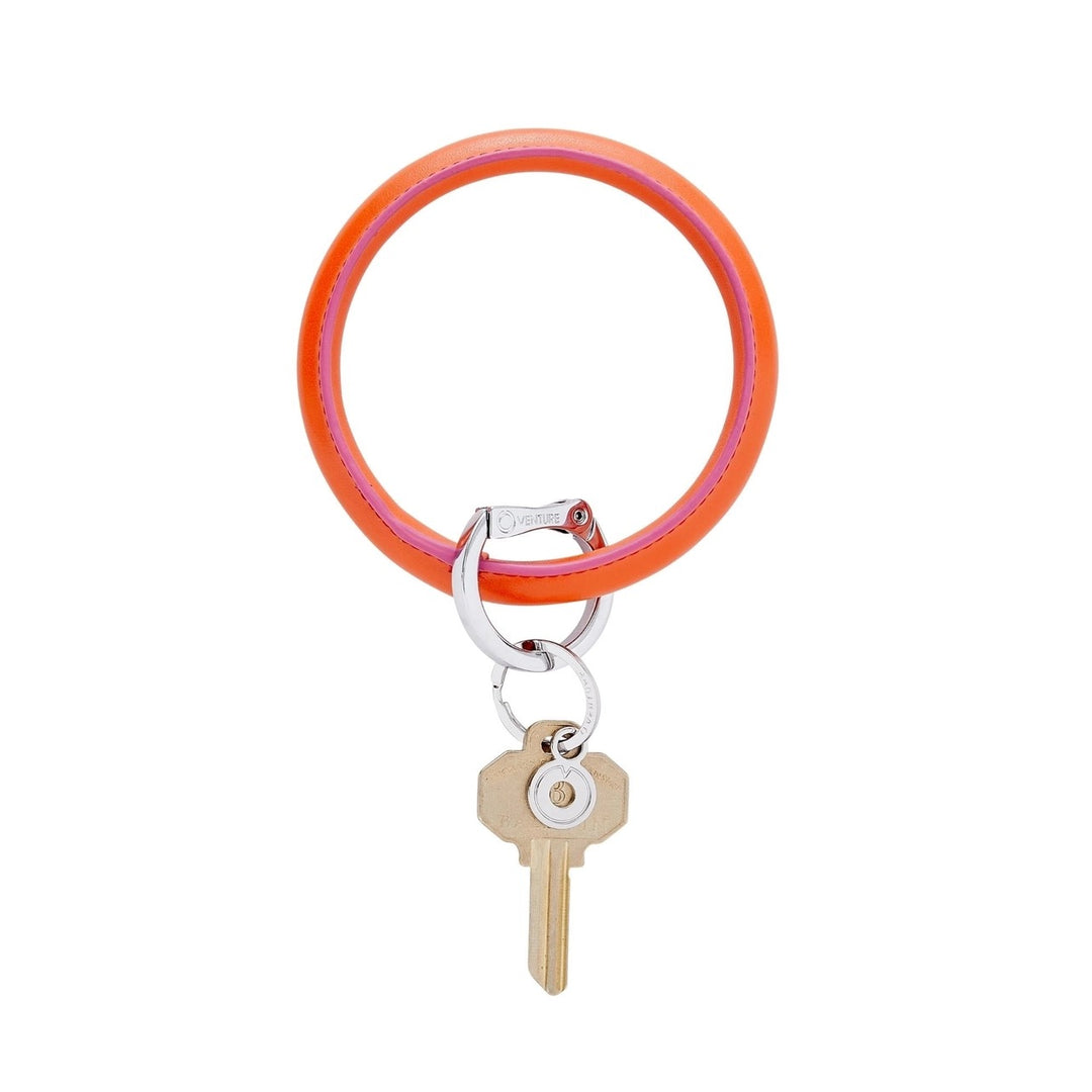 O-venture "O" Ring leather key ring with a sleek leather strap and metal "O" ring, perfect for holding keys or accessories.