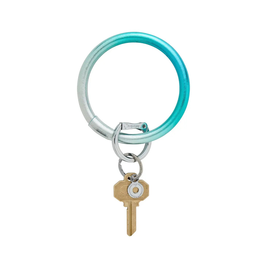 O-venture leather key ring with "O" ring design, featuring a durable leather strap and keyring for stylish key organization.