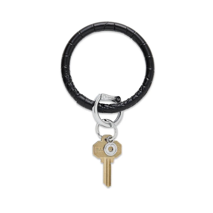O-venture leather "O" ring key ring with engraved "O" logo, designed for holding keys and accessories.