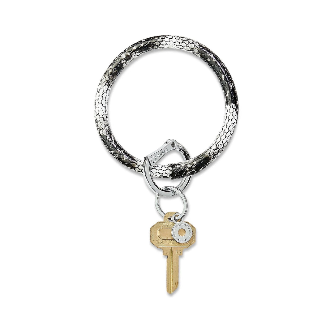 O-venture leather "O" ring key ring with sleek design, featuring a durable leather strap and metal ring for keys or accessories.