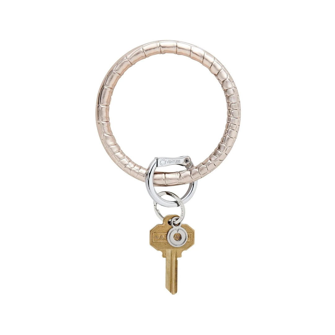 O-venture "O" Ring leather key ring with sleek leather strap and metal ring for holding keys or small accessories.