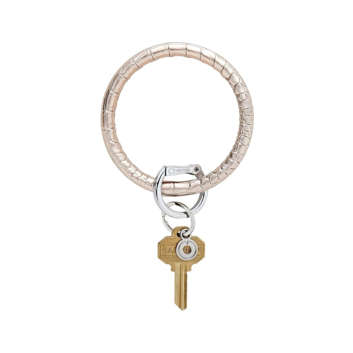 O-venture "O" Ring leather key ring with sleek leather strap and metal ring for holding keys or small accessories.