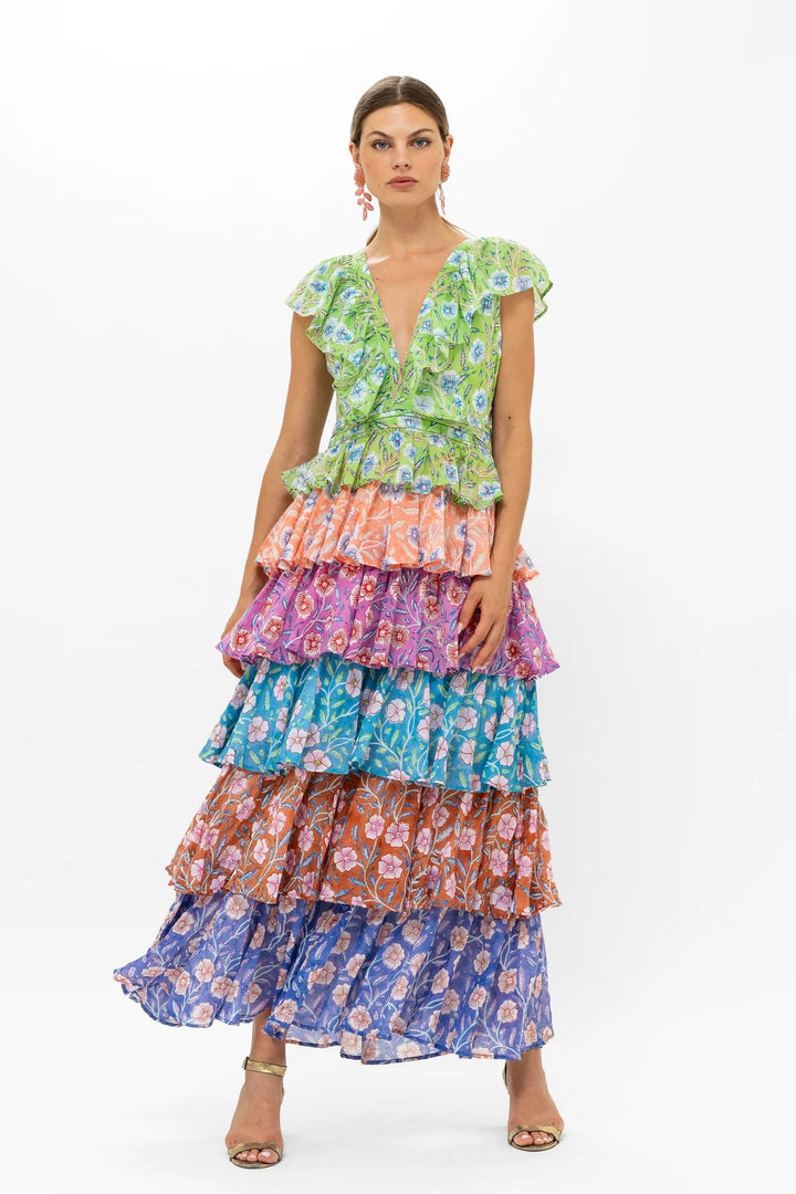 Oliphant Yoke Ruffle Maxi Dress with flowing fabric and ruffle details, styled with a fitted bodice and full-length skirt.