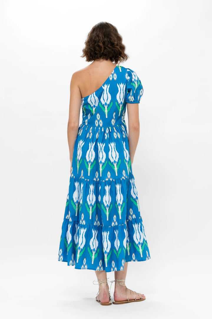 Oliphant one-shoulder maxi dress with flowing fabric, elegant design, and fitted waist, perfect for formal occasions.