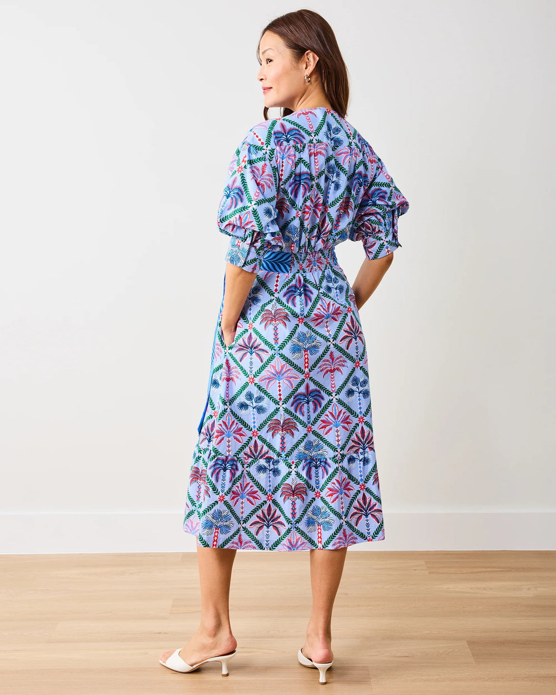 Print Fresh Gabriela Palm Tree Dress featuring a vibrant palm pattern and flowy silhouette, perfect for casual or summer wear.