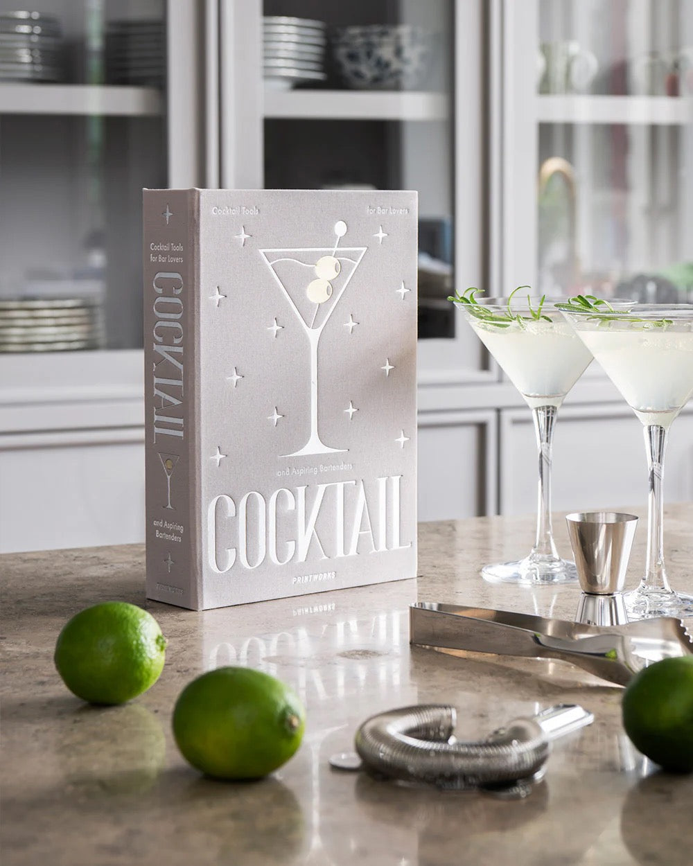 Printworks Essentials Drink Tools Kit for home use, includes bar tools like shaker, strainer, and corkscrew for cocktail preparation.