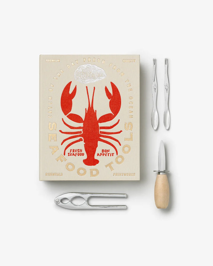 Printworks Essentials Seafood Tools Kit with seafood crackers, picks, and scissors for home use, displayed on a wooden surface.