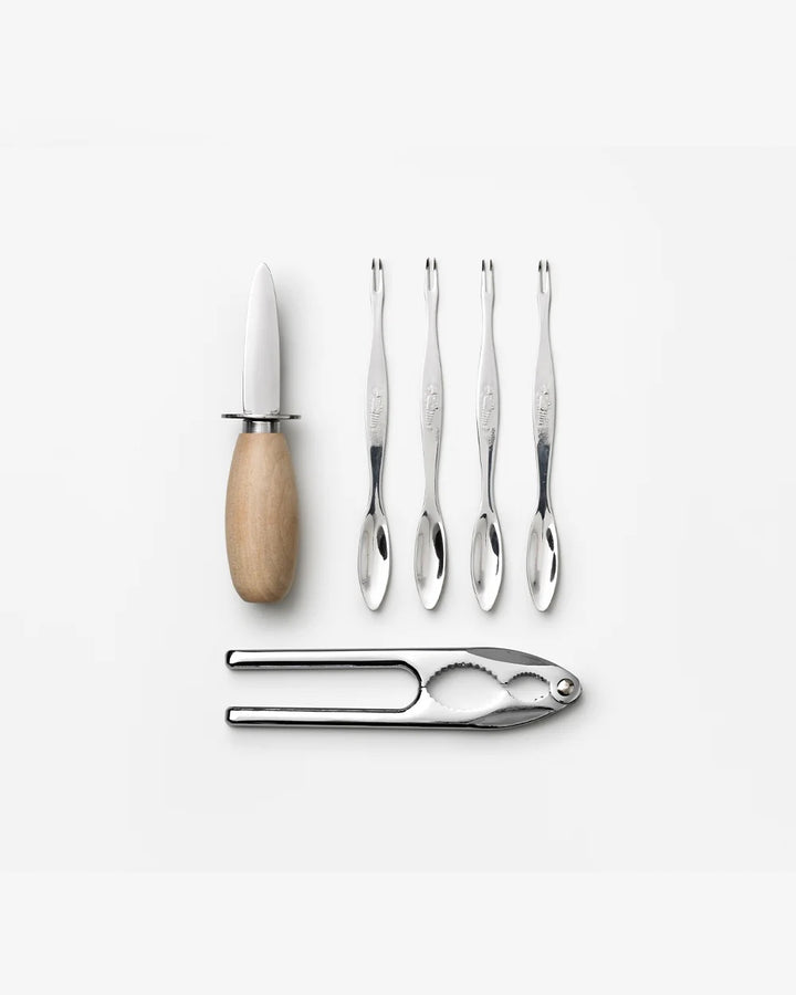 Printworks Essentials Seafood Tools Kit for home use, includes seafood crackers, picks, and utensils on a wooden surface.