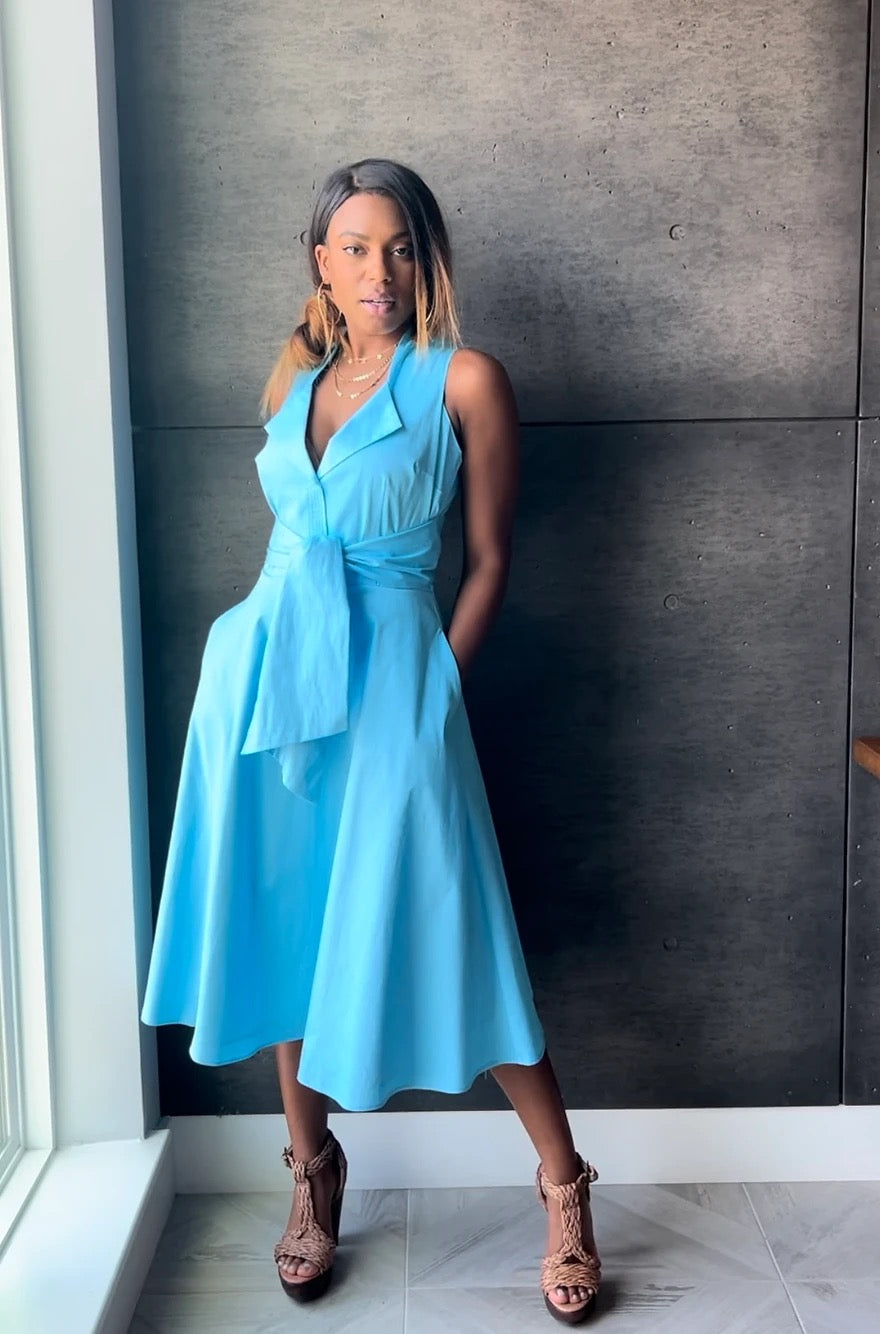 Rainment Hermosa Cove Dress shown in a stylish, flowy design with floral patterns and vibrant colors.