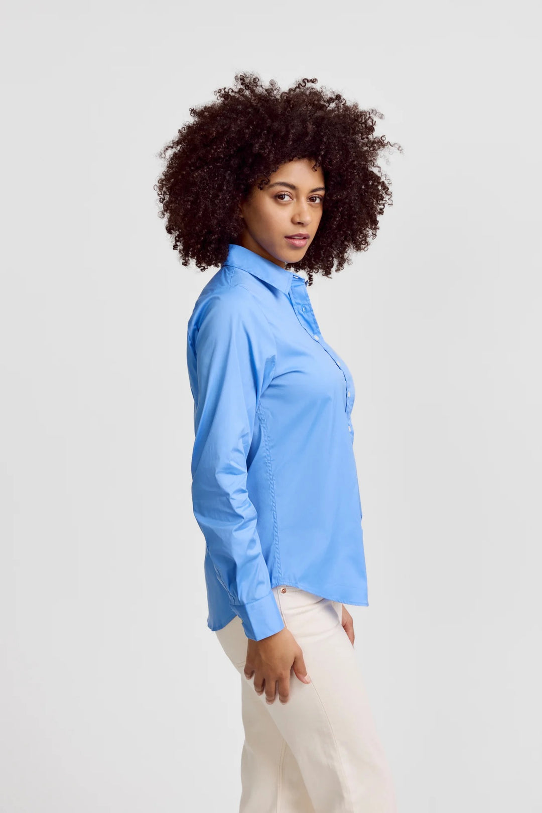 French Blue Icon Shirt by Rochelle Behrens, stylish tops featuring a vibrant blue color and classic design, shown on a model.