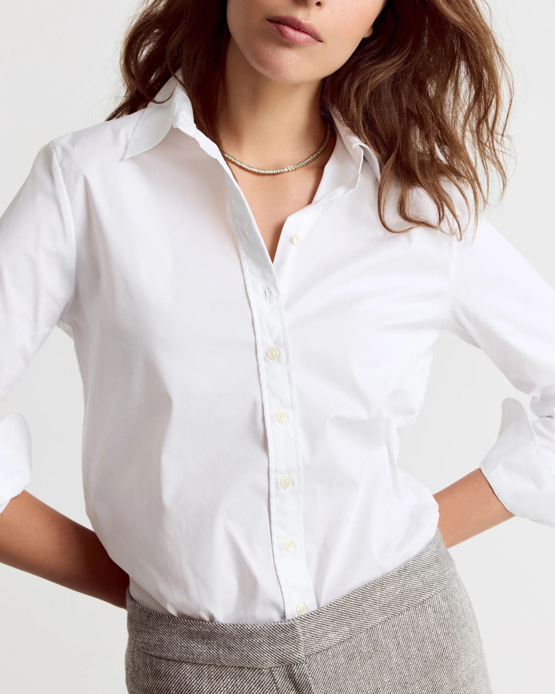 White Rochelle Behrens Icon shirt, a stylish women's top with clean lines and classic design, shown on a model.