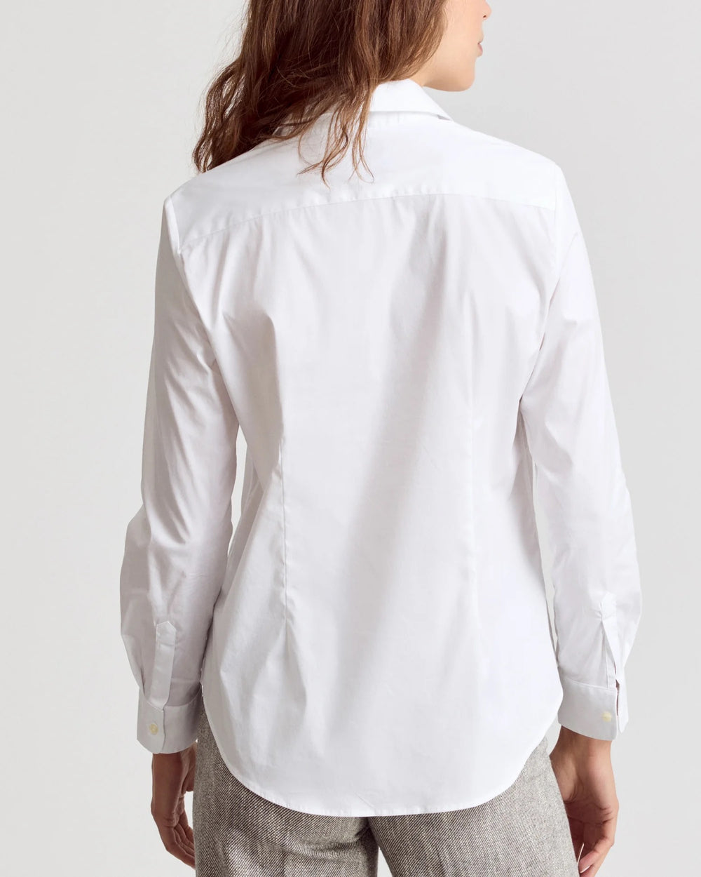 White Icon Shirt by Rochelle Behrens, stylish women's top shown on a model with a classic collar and button front.