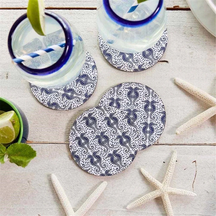Set of four Rockflowerpaper home coasters featuring stylish, decorative designs for protecting surfaces.