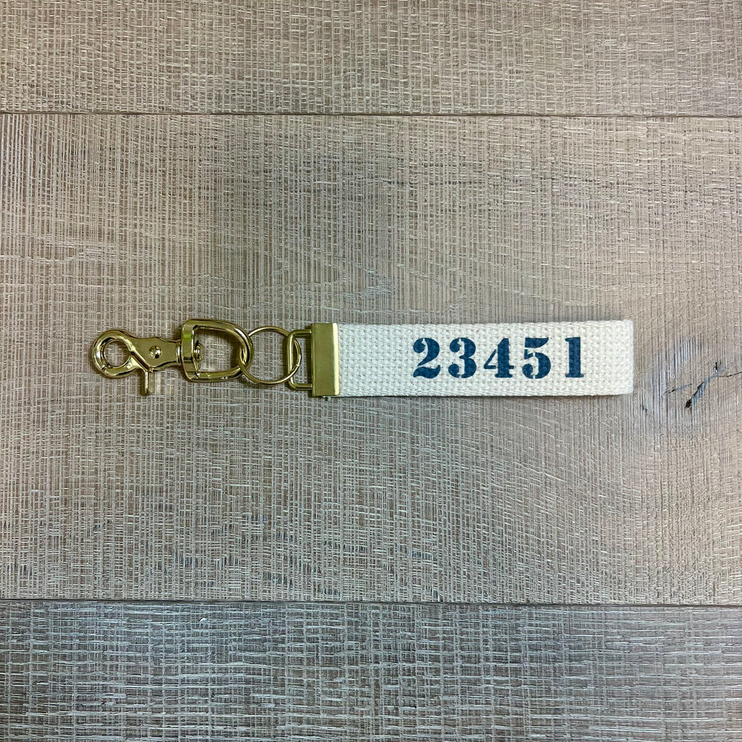 Rustic Marlin local key fobs gift set with decorative keychain accessories on a neutral background.