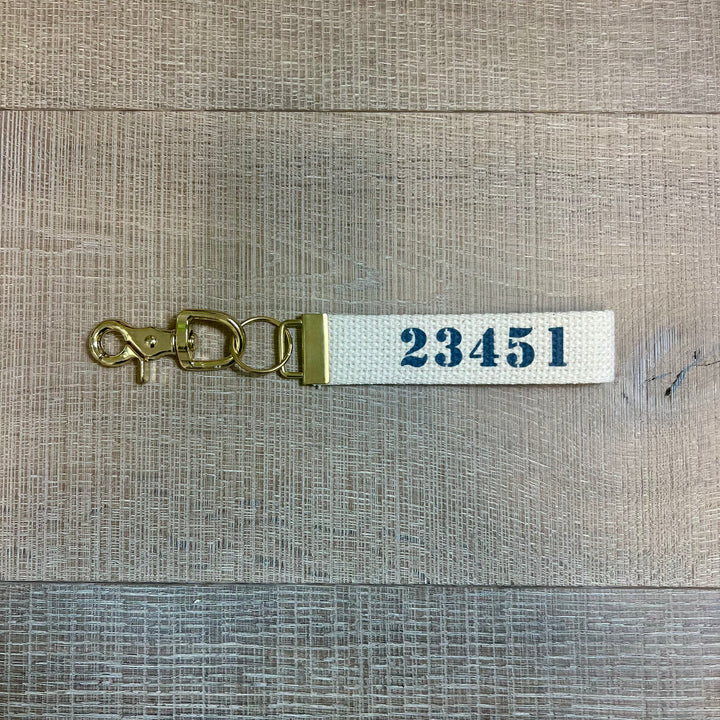 Rustic Marlin local key fobs gift set with decorative keychain accessories on a neutral background.