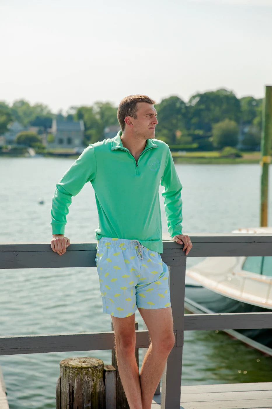 Men's Sail to Sable umbrella print swim trunks, casual loungewear with a relaxed fit, featuring vibrant umbrella pattern.
