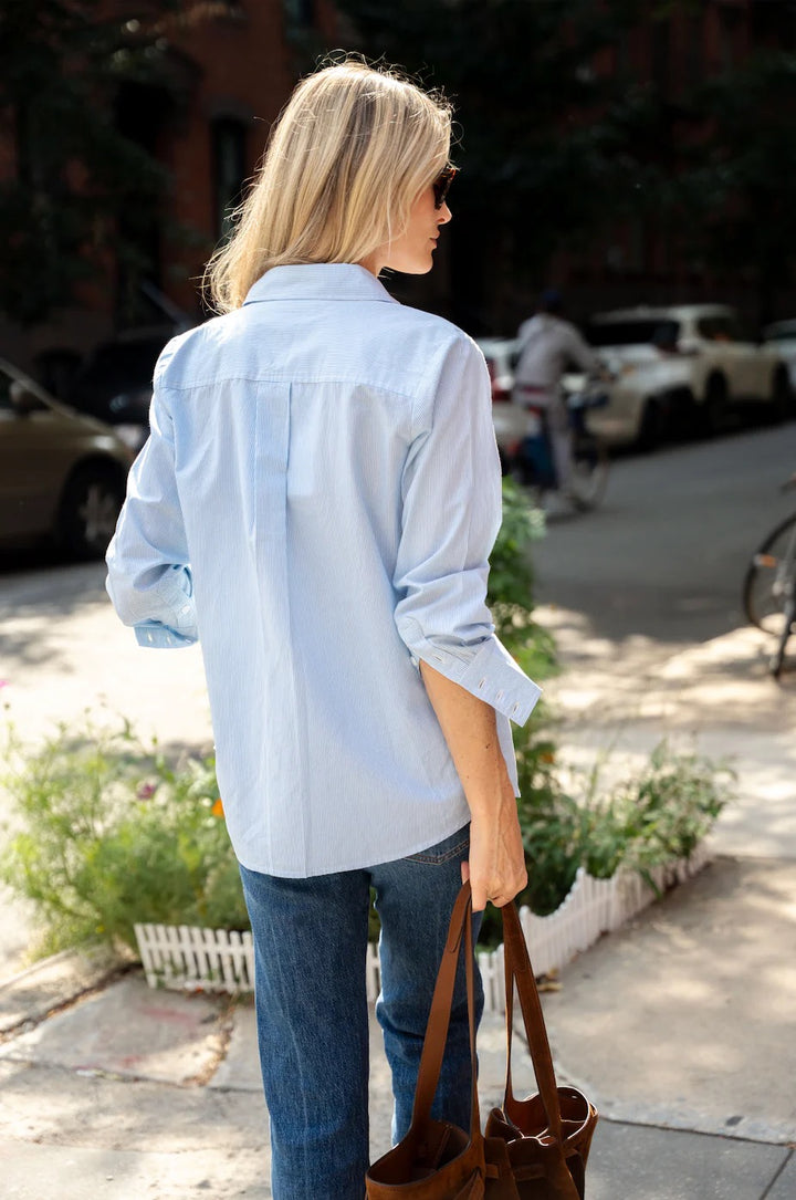 Sail to Sable button down embroidered shirt, a stylish tops with intricate embroidery, displayed on a hanger against a neutral background.