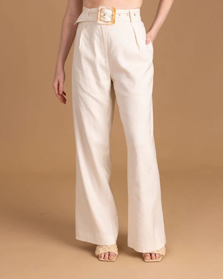 Sedge Peyton Pant bottoms in neutral fabric, featuring a relaxed fit and classic waistband, displayed on a hanger.
