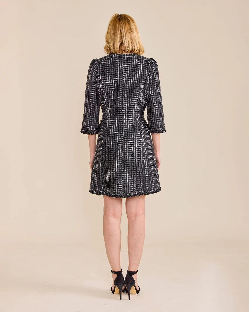 Sedge rose dress featuring a flowing fabric and floral design, displayed on a hanger against a neutral background.