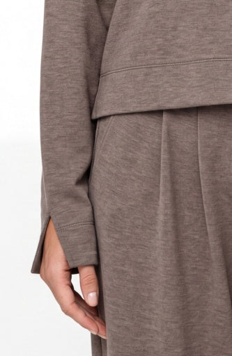 Liverpool Jeans long sleeve boatneck top in a neutral color, shown on a mannequin with a relaxed fit and ribbed cuffs.